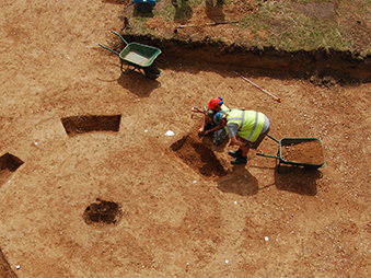 people excavating a ring ditch