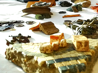 assortment of archaeological objects on table