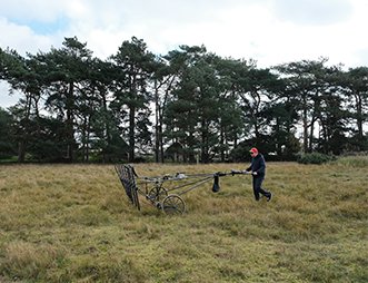 person using magnetometer cart