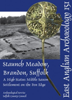 front cover with photo of excavation and pin