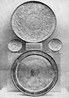 black and white photo of large plates on display at British Museum 1947