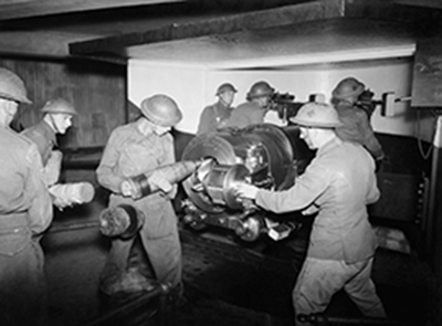 Staged photo soldiers inside the gunhouse at Felixstowe